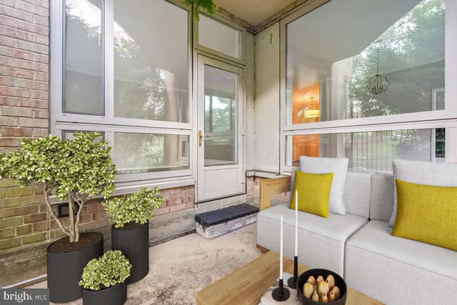 a kitchen with granite countertop white cabinets and appliances