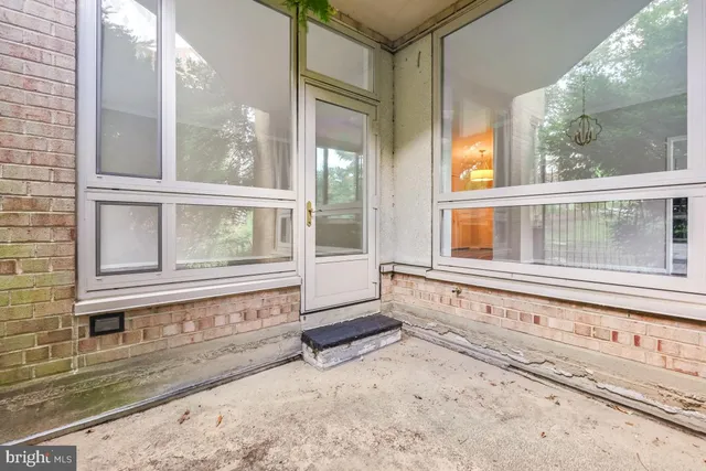 a kitchen with granite countertop stainless steel appliances white cabinets and a sink