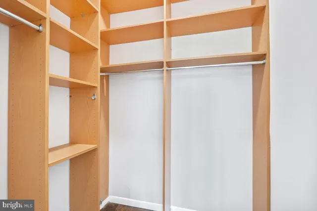 a bedroom with a large bed and a large window