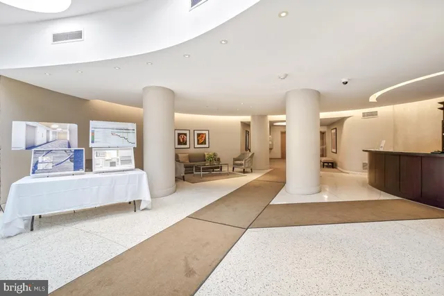 a view of living room with furniture and a table