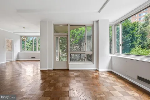 a view of an empty room with a window