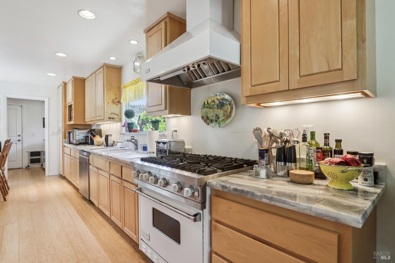 322 Mockingbird Circle Santa Rosa, CA 95409 - Photo 11 of 44 a kitchen with stainless steel appliances granite countertop a stove a sink and cabinets