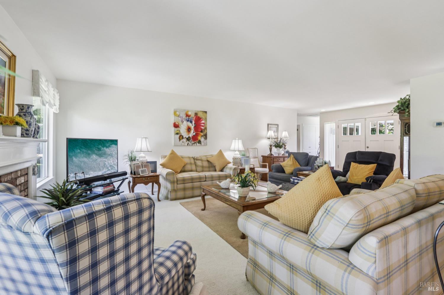 322 Mockingbird Circle Santa Rosa, CA 95409 - Photo 13 of 44 a living room with furniture or couch and a fireplace