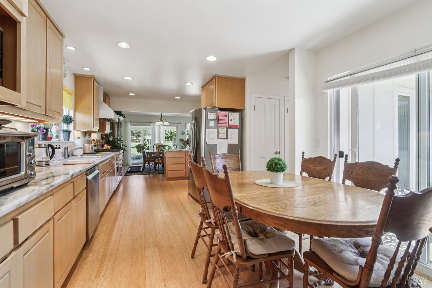 322 Mockingbird Circle Santa Rosa, CA 95409 - Photo 23 of 44 a dining room with furniture and wooden floor