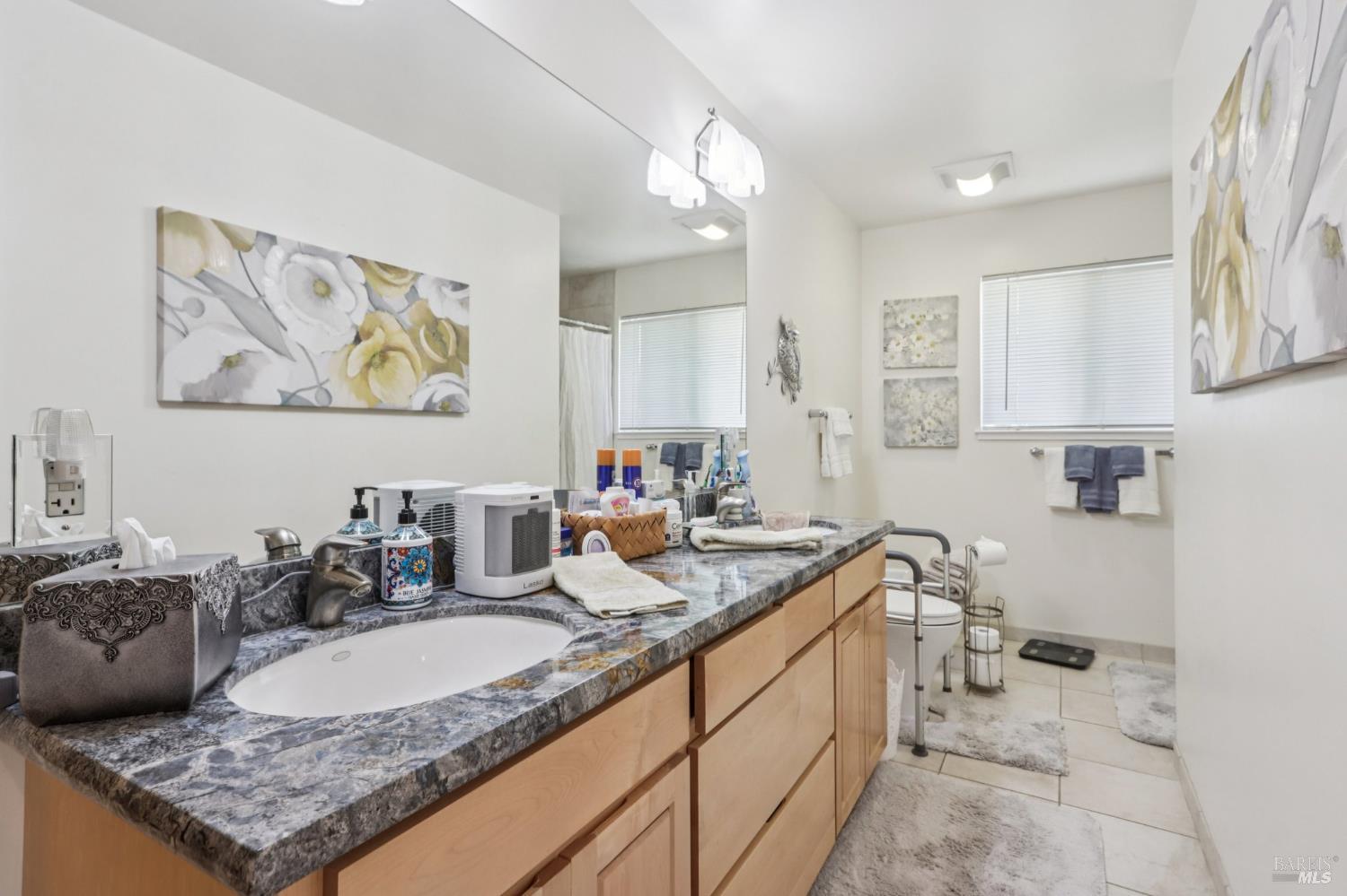 322 Mockingbird Circle Santa Rosa, CA 95409 - Photo 31 of 44 a kitchen with a sink stove and cabinets