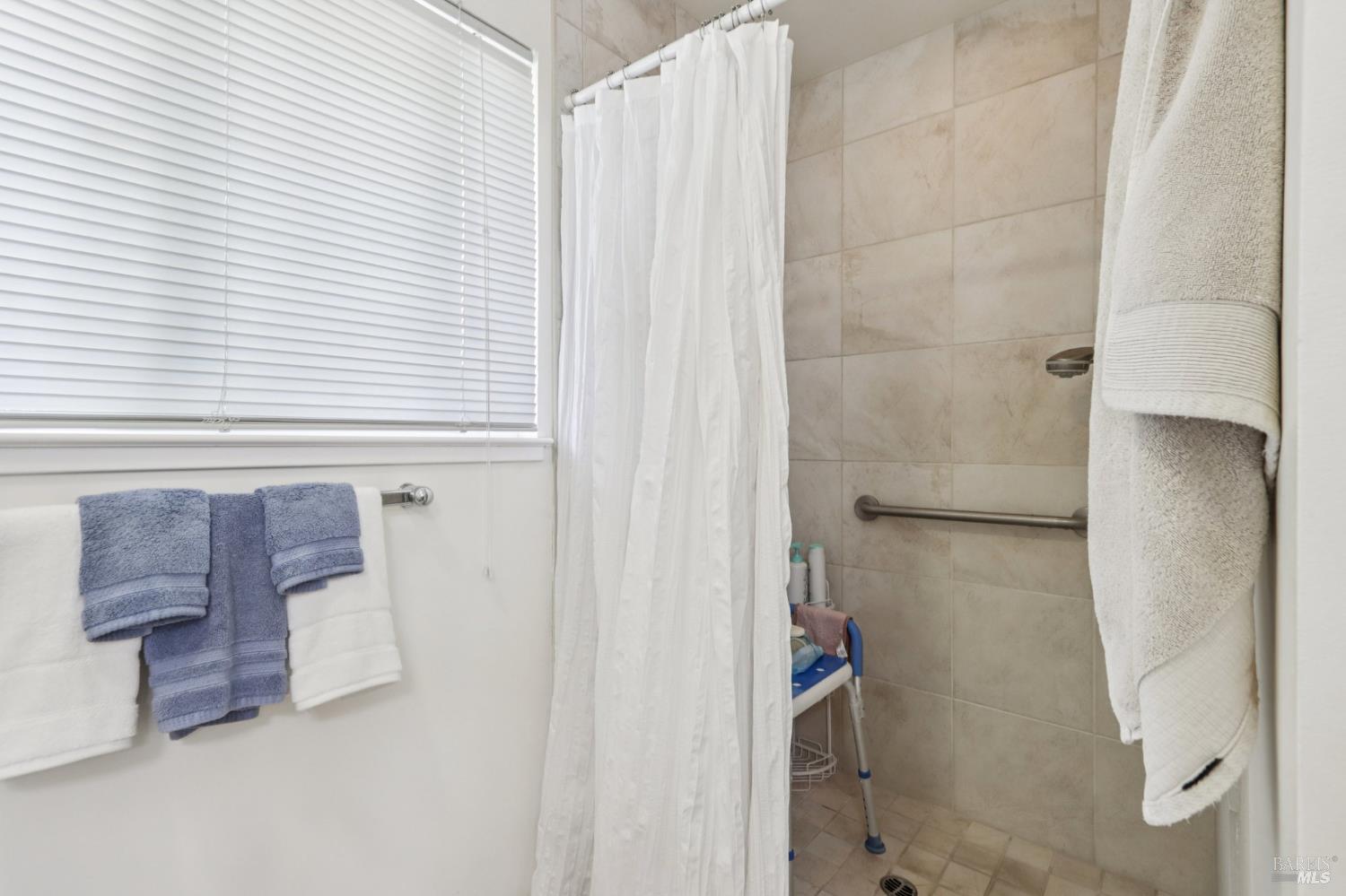 322 Mockingbird Circle Santa Rosa, CA 95409 - Photo 32 of 44 a bathroom with a bathtub and shower