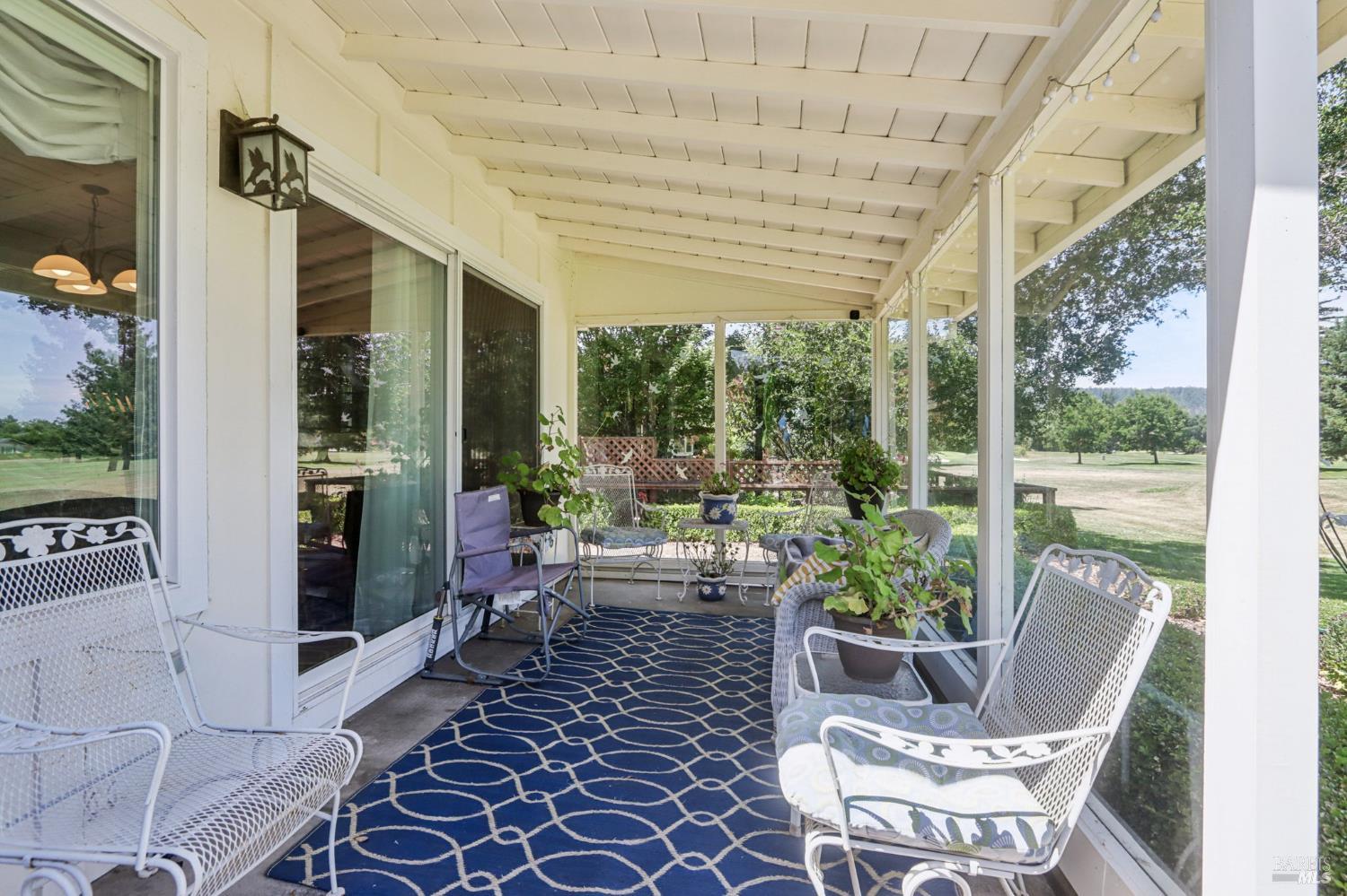 322 Mockingbird Circle Santa Rosa, CA 95409 - Photo 35 of 44 a view of a patio with table and chairs and potted plants