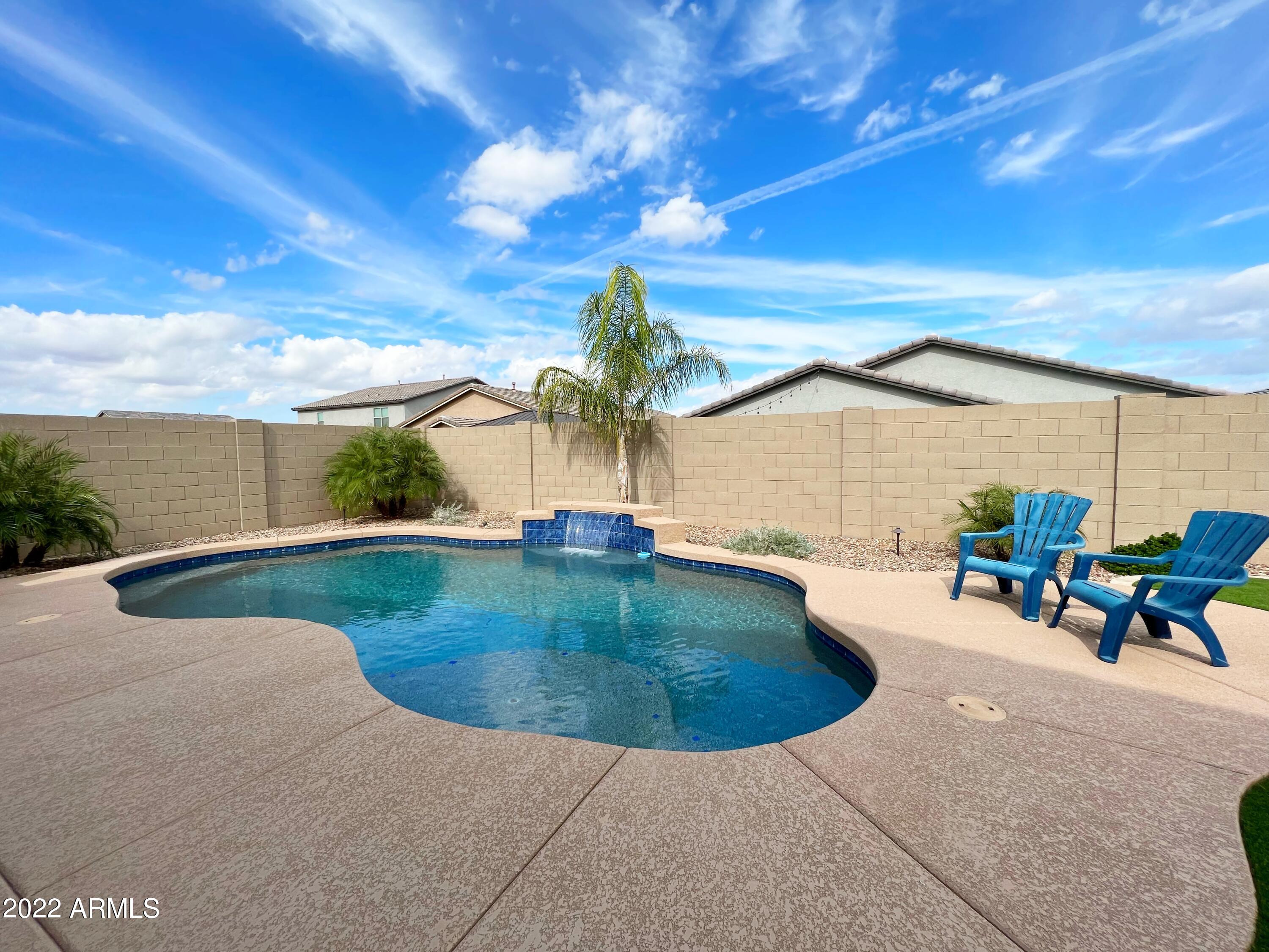 3330 West Fremont Rd. Phoenix, AZ 85041 - Photo 30 of 43 a view of a swimming pool with a patio