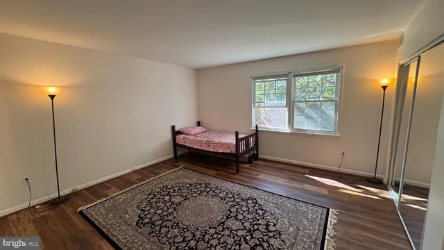 a bed room with a bed and a window