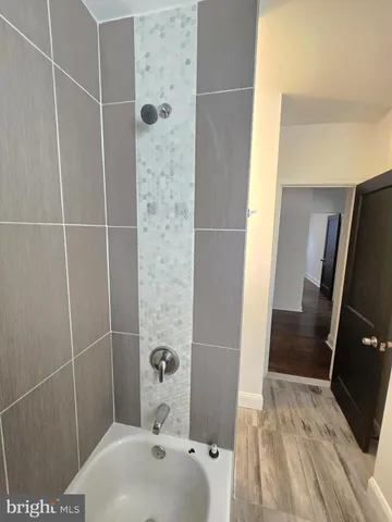 a bathroom with a sink and shower