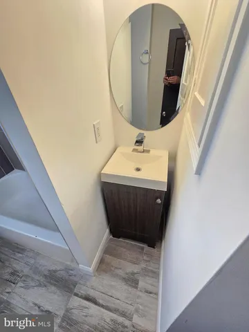 a bathroom with a sink and mirror
