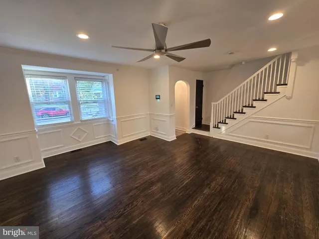 a view of an entryway with wooden floor