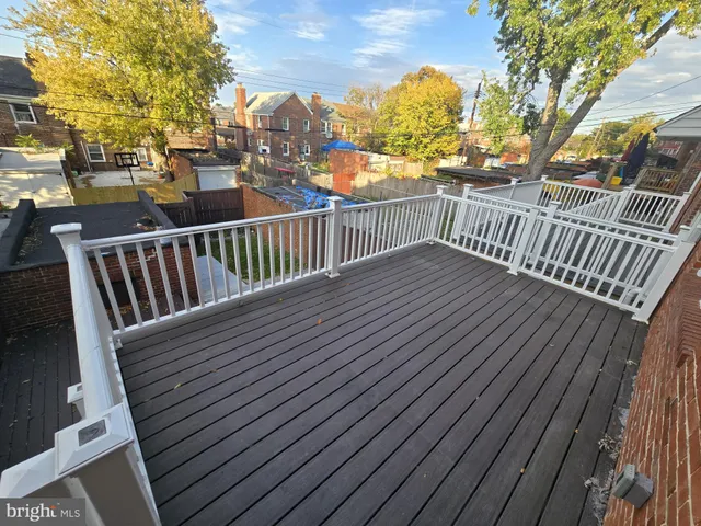 a view of balcony with wooden floor