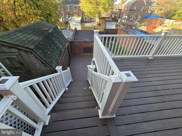 a view of balcony with wooden floor