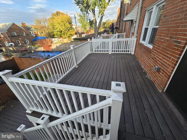 a view of balcony with wooden floor