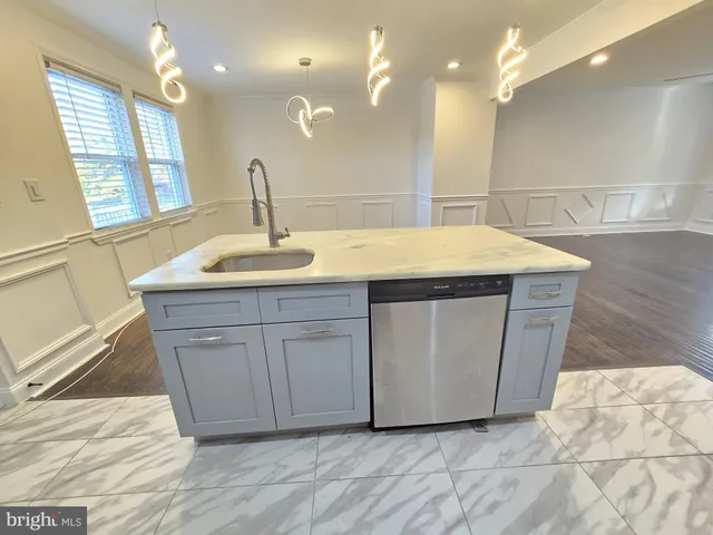 a bathroom with a sink a vanity and a mirror
