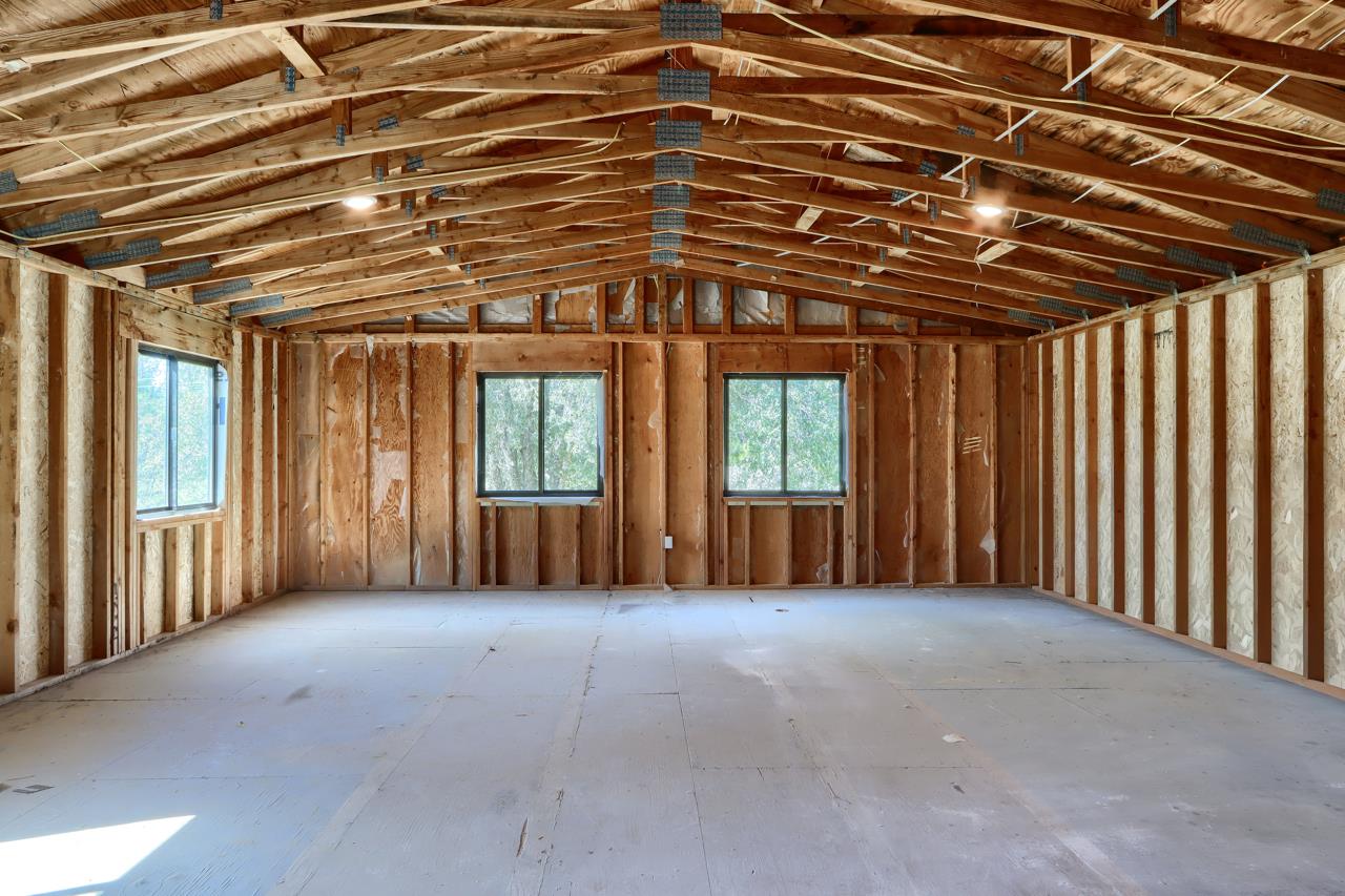 3181 Triangle Park Road Mariposa, CA 95338 - Photo 37 of 46 Unfinished area above garage - secondary entrance (pre-plumbed and pre-wired)