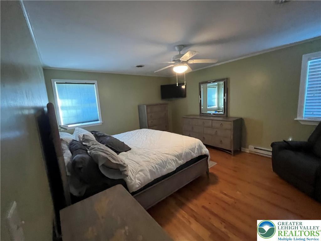 6221 Dove Drive Bethlehem, PA 18017 - Photo 18 of 38 Warm hardwood flooring runs throughout this comfortable bedroom accented by classic crown molding.