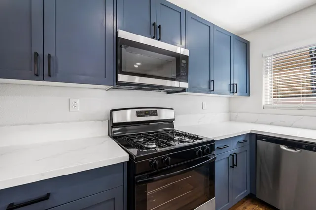 a view of kitchen and microwave