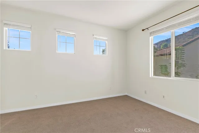 a large white kitchen with a sink