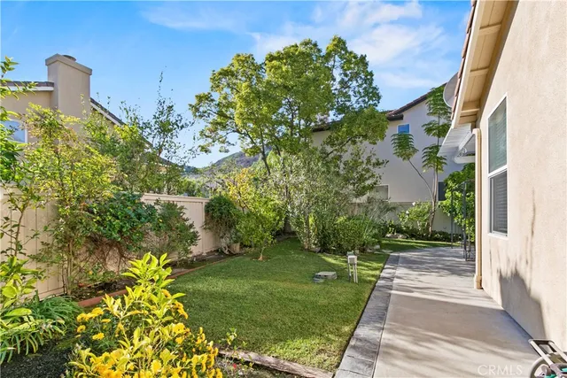 a view of yard with patio