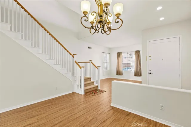 a view of an entryway with wooden floor