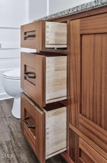 a view of a house with a wooden fence