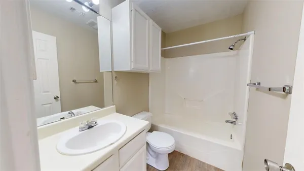 a view of bathroom with a sink and mirror
