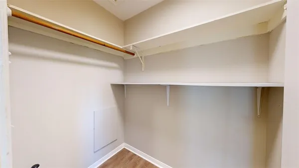 a view of backyard with wooden fence