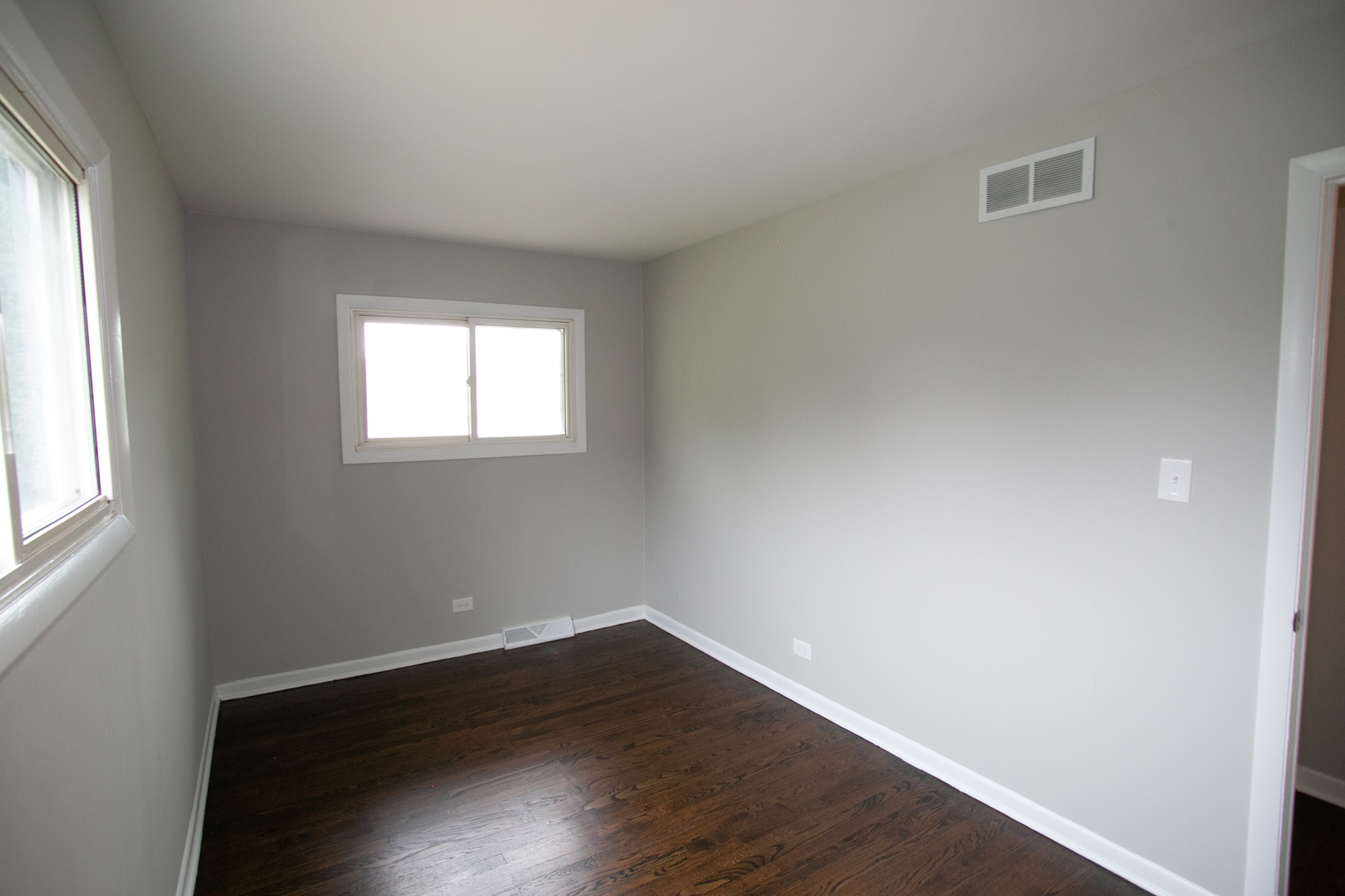 N169 North Prince Crossing Road West Chicago, IL 60185 - Photo 11 of 21 an empty room with wooden floor and windows