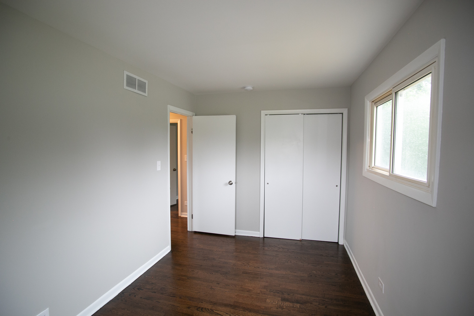 N169 North Prince Crossing Road West Chicago, IL 60185 - Photo 12 of 21 an empty room with wooden floor and windows
