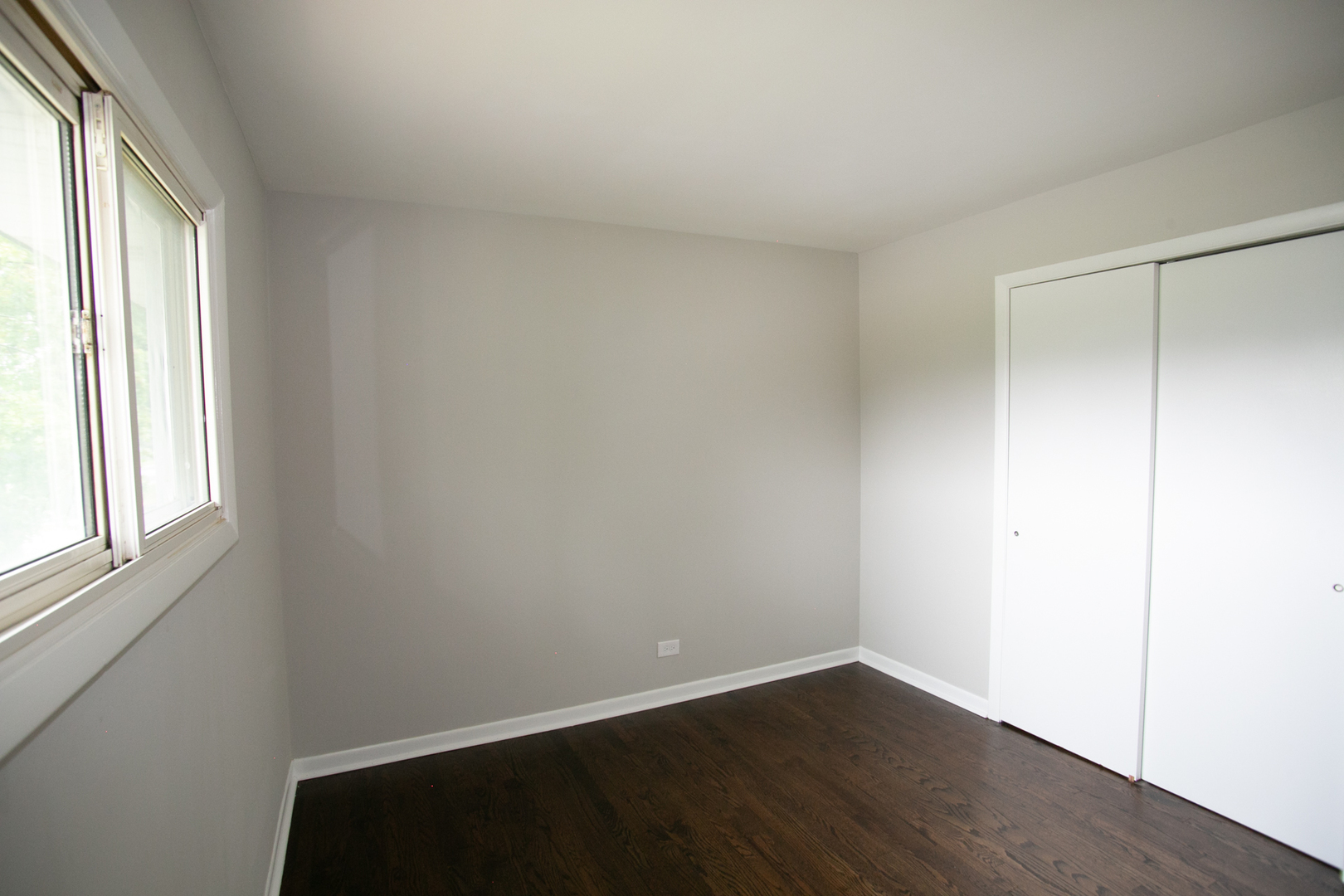 N169 North Prince Crossing Road West Chicago, IL 60185 - Photo 14 of 21 an empty room with wooden floor and windows