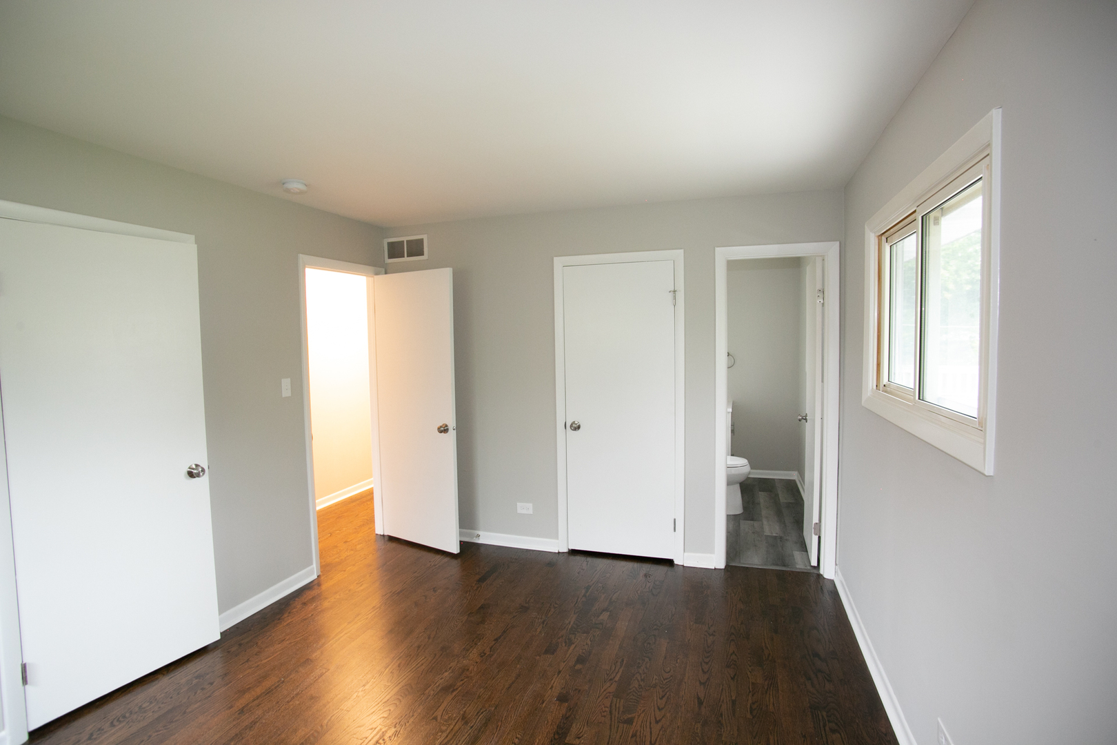 N169 North Prince Crossing Road West Chicago, IL 60185 - Photo 16 of 21 an empty room with wooden floor and windows