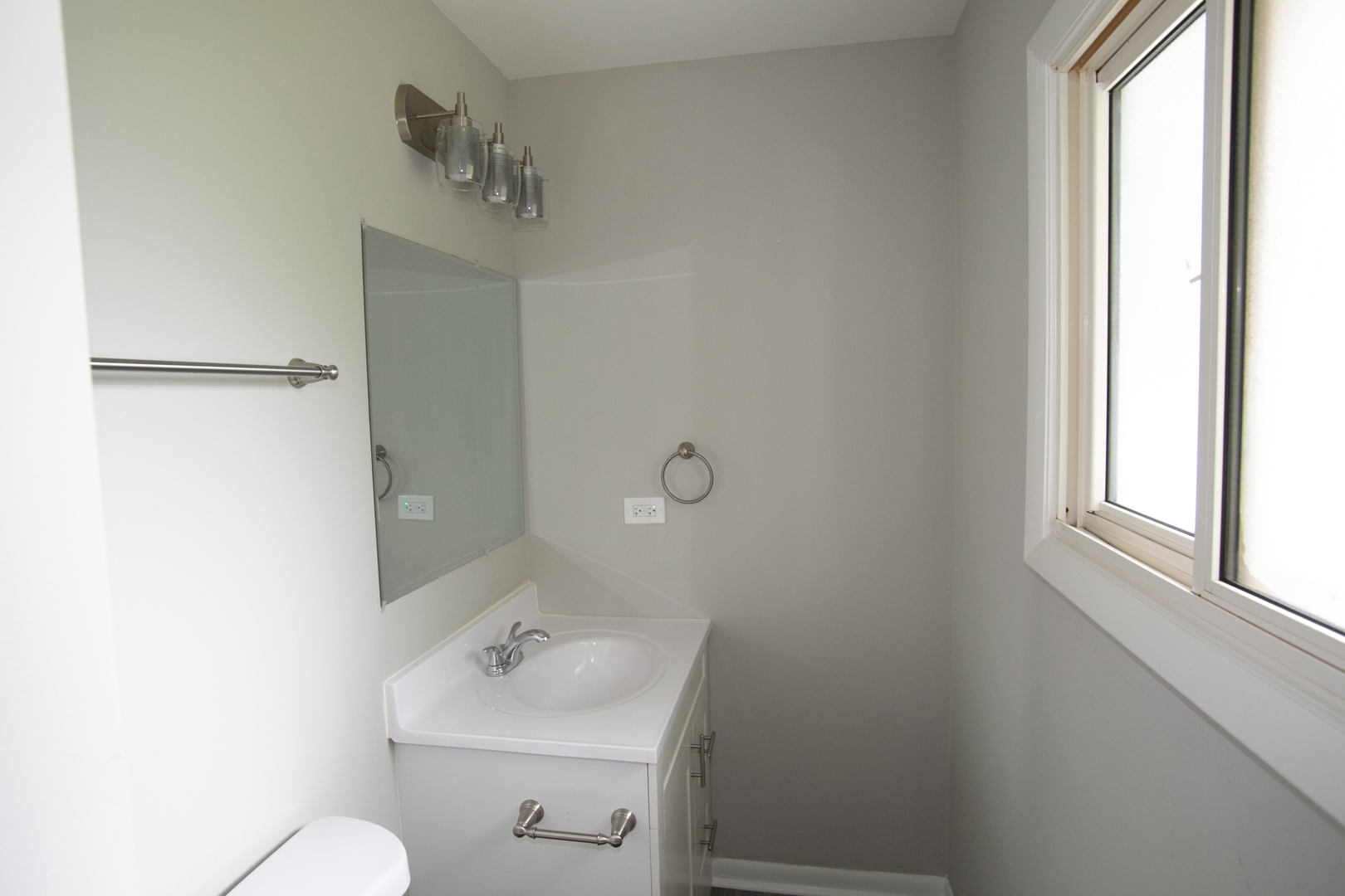N169 North Prince Crossing Road West Chicago, IL 60185 - Photo 17 of 21 a bathroom with a sink mirror and toilet
