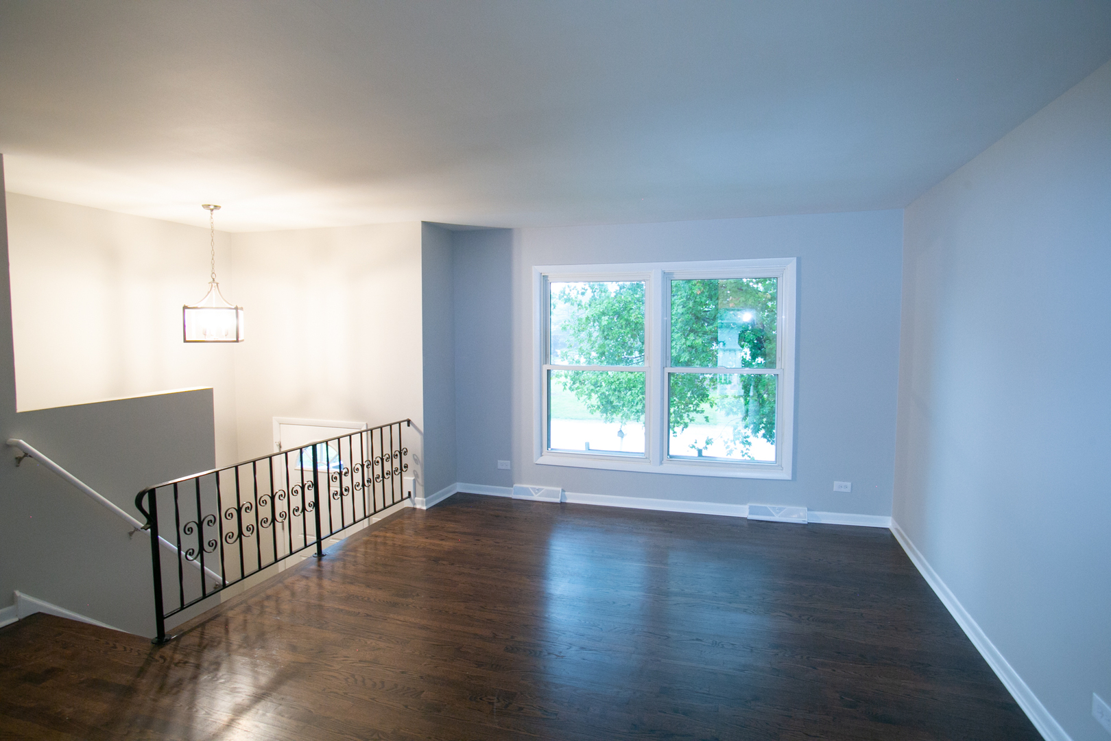 N169 North Prince Crossing Road West Chicago, IL 60185 - Photo 3 of 21 an empty room with wooden floor and windows