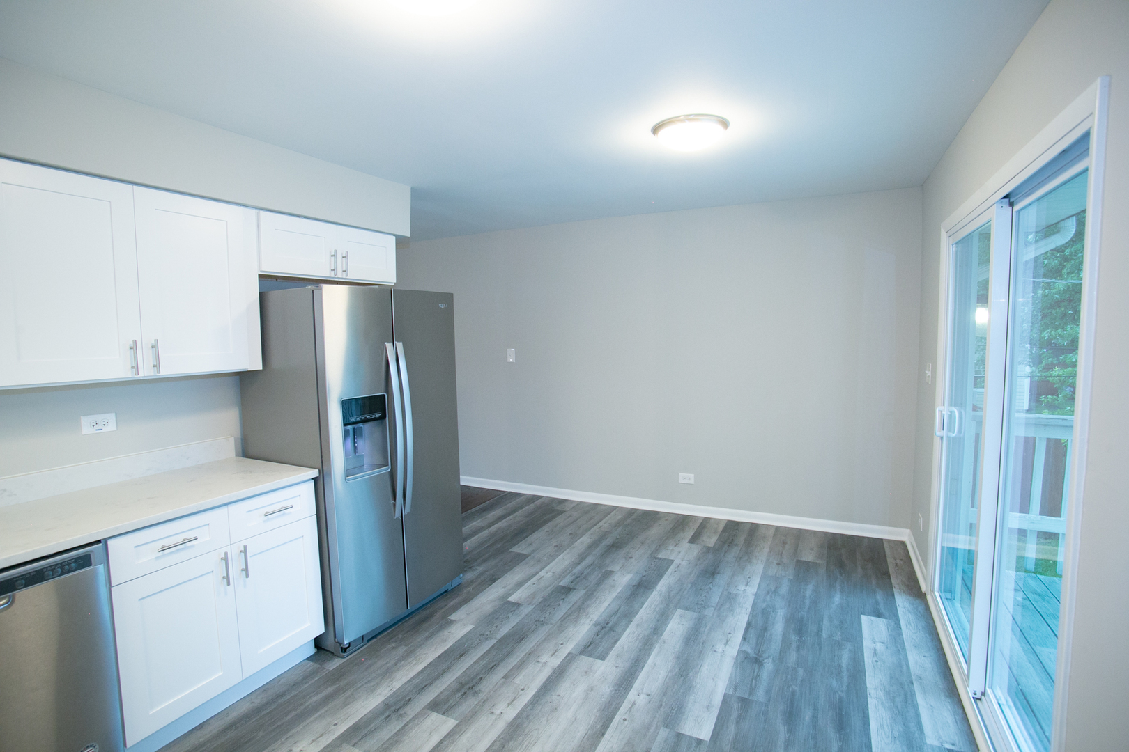 N169 North Prince Crossing Road West Chicago, IL 60185 - Photo 6 of 21 a kitchen with a refrigerator and white cabinets