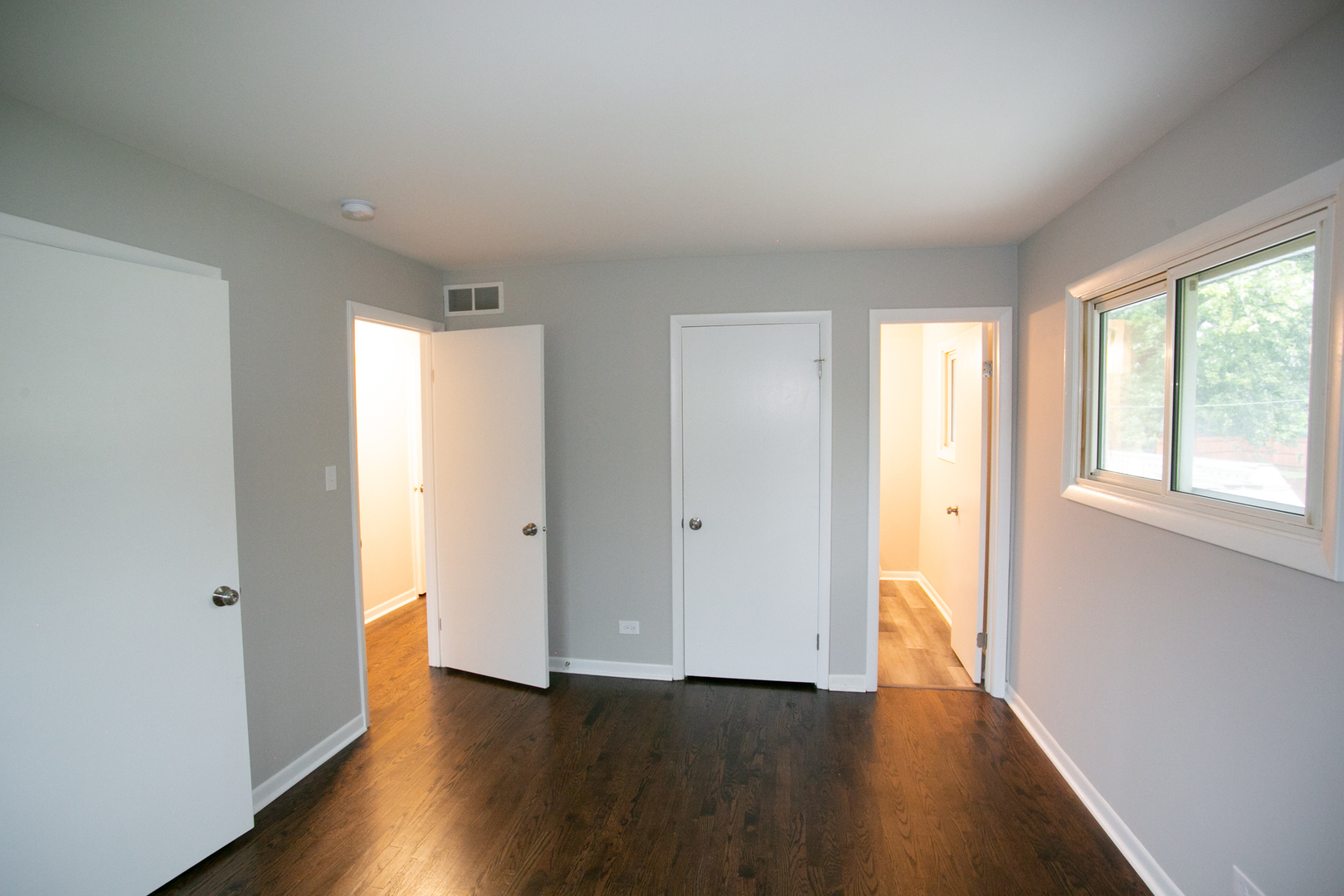 N169 North Prince Crossing Road West Chicago, IL 60185 - Photo 9 of 21 a view of an empty room with wooden floor and a window