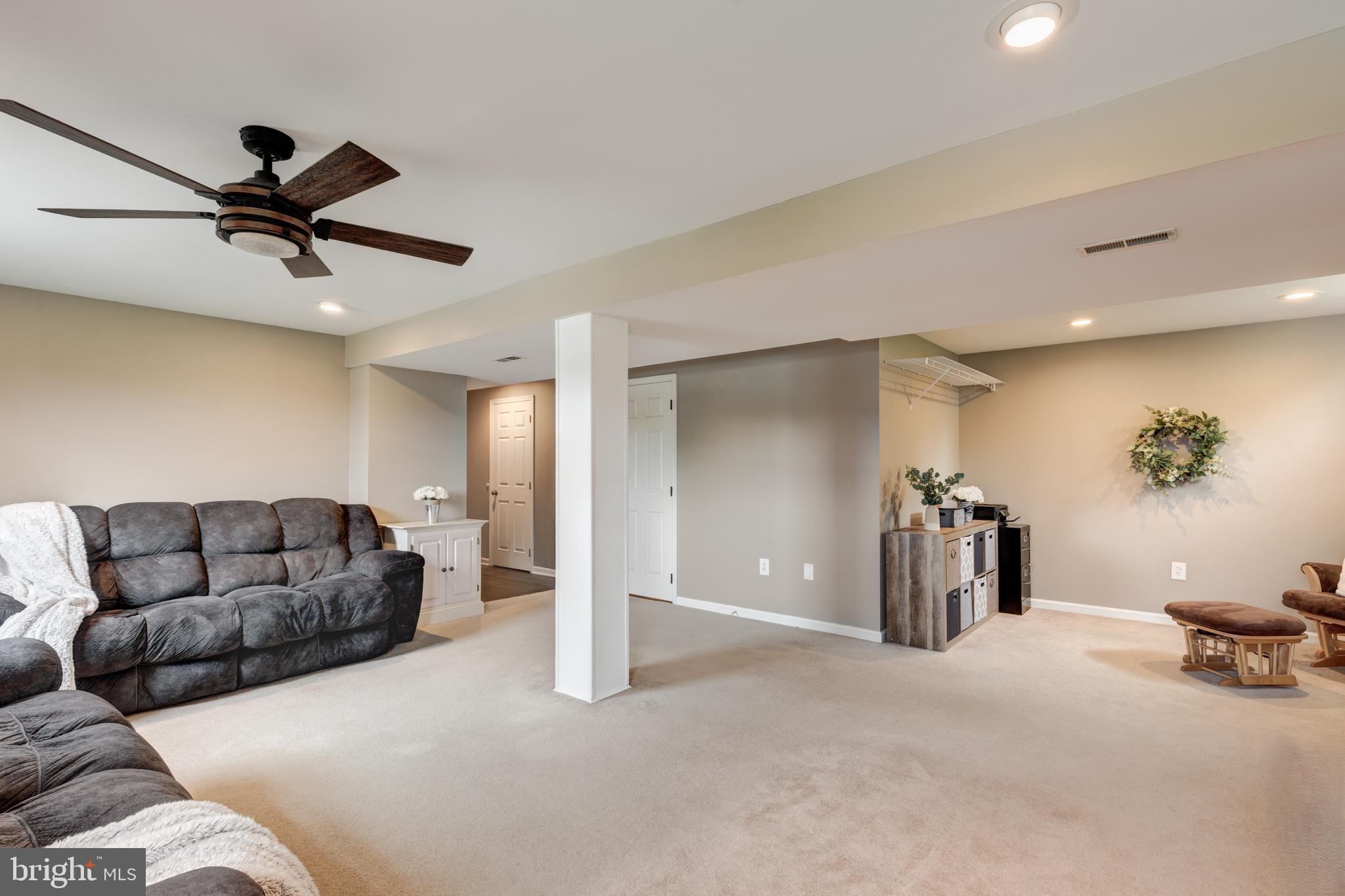312 Inverness Close Westminster, MD 21158 - Photo 24 of 36 a living room with furniture and a ceiling fan