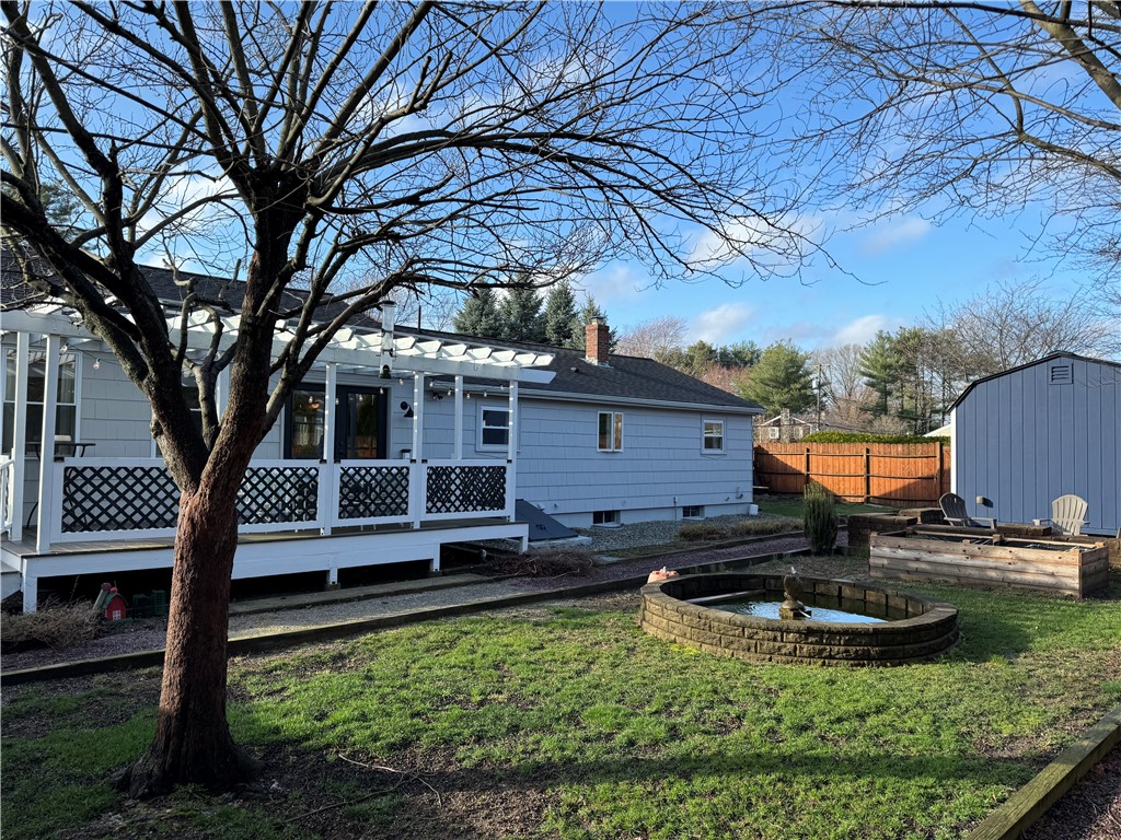 122 Greenville Road North Smithfield, RI 02896 - Photo 18 of 20 Spacious deck faces the koi pond.