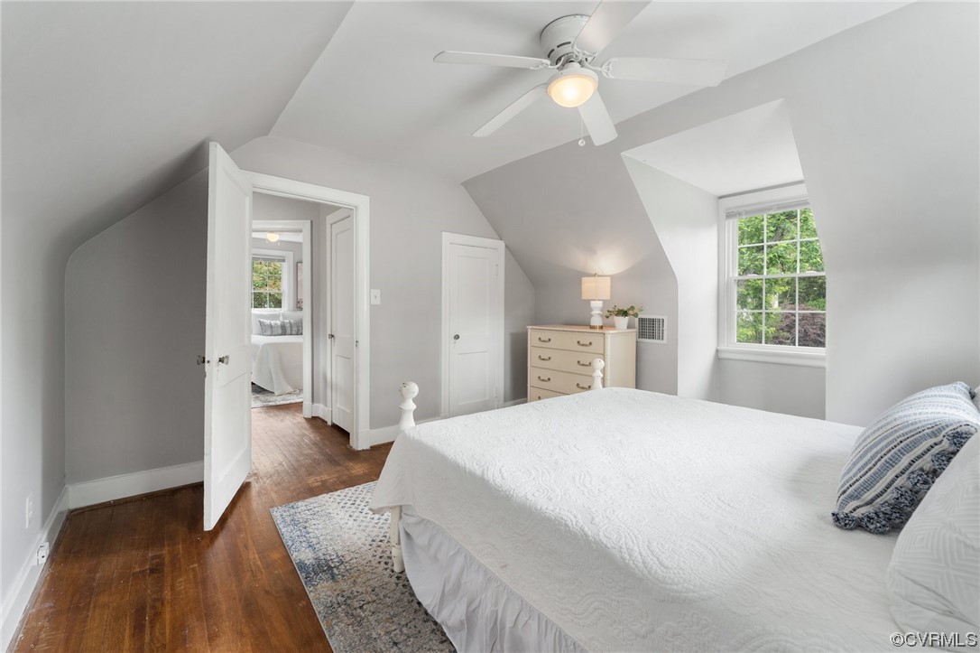 7503 Glebe Road Henrico, VA 23229 - Photo 17 of 25 a spacious bedroom with a bed and a chandelier