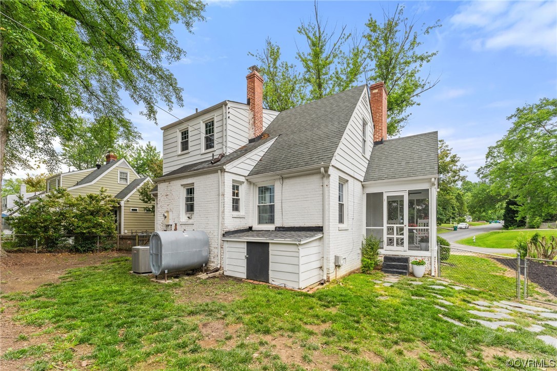 7503 Glebe Road Henrico, VA 23229 - Photo 23 of 25 a front view of house with yard and trees in the background