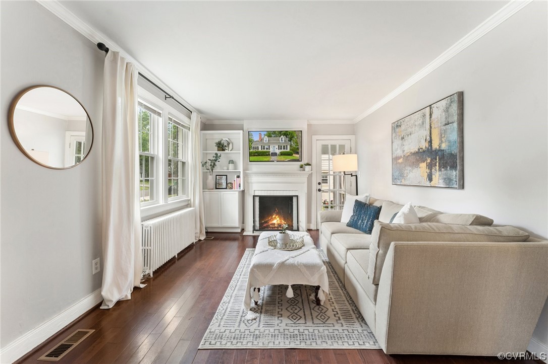 7503 Glebe Road Henrico, VA 23229 - Photo 4 of 25 a living room with furniture a window and a fireplace