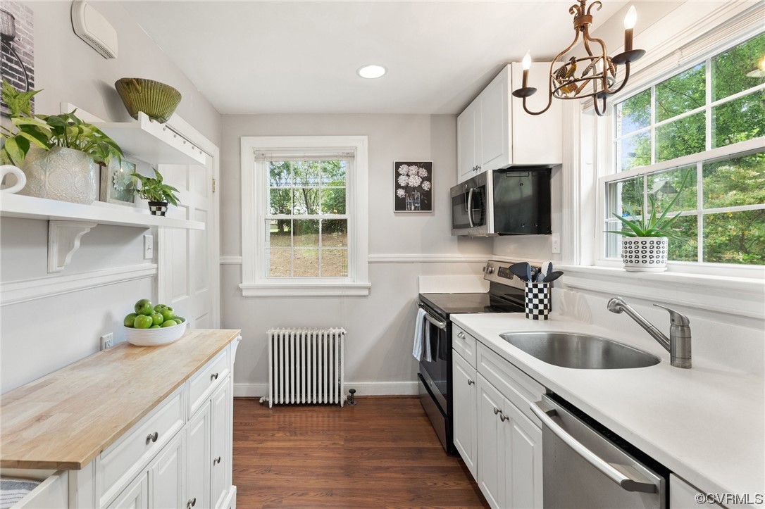 7503 Glebe Road Henrico, VA 23229 - Photo 8 of 25 a kitchen with a sink a counter top space and living room view