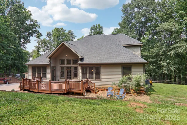 a view of a house with a yard porch and sitting area