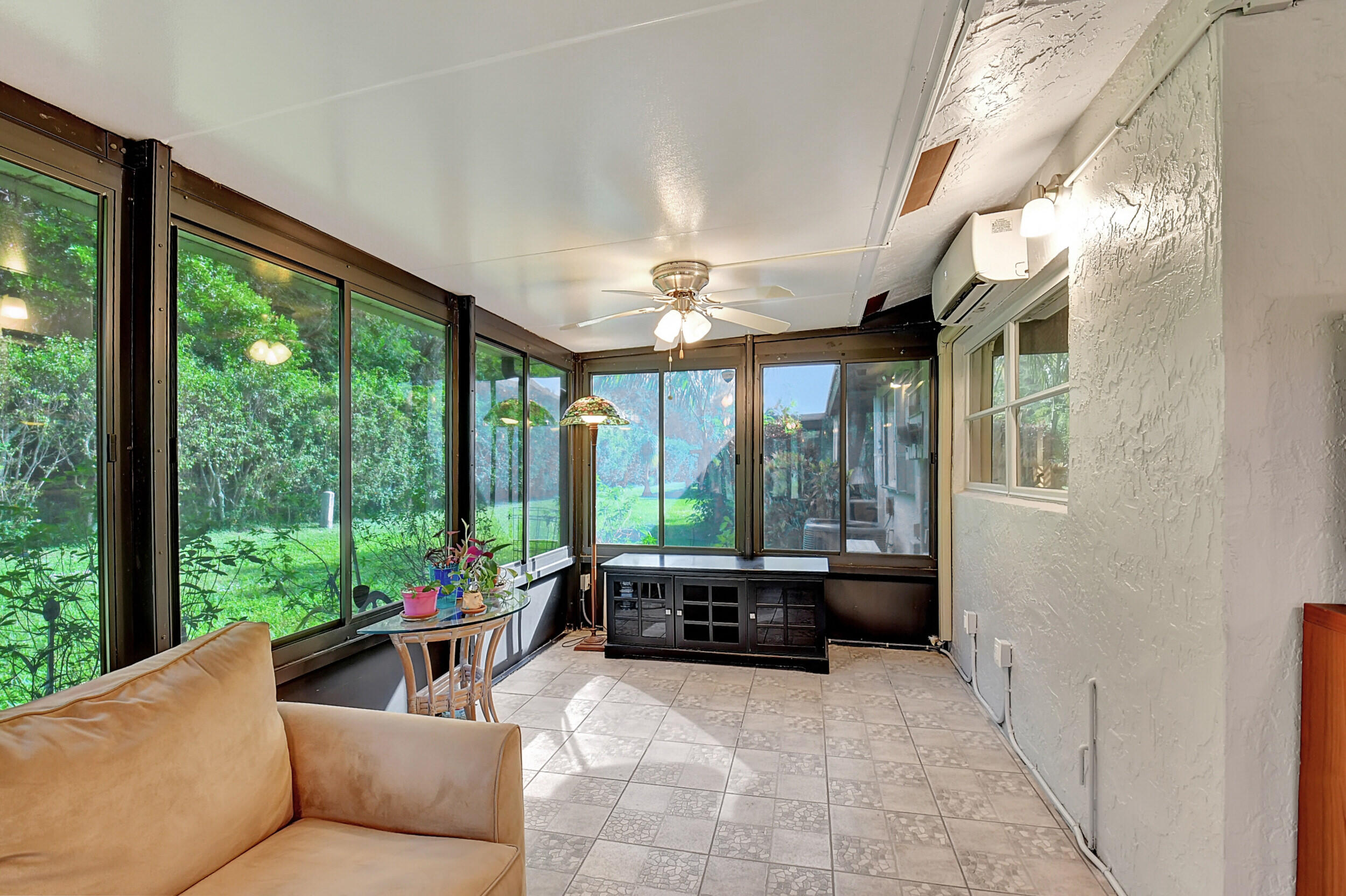 14520 Lucy Drive Delray Beach, FL 33484 - Photo 12 of 63 a living room with furniture and a large window