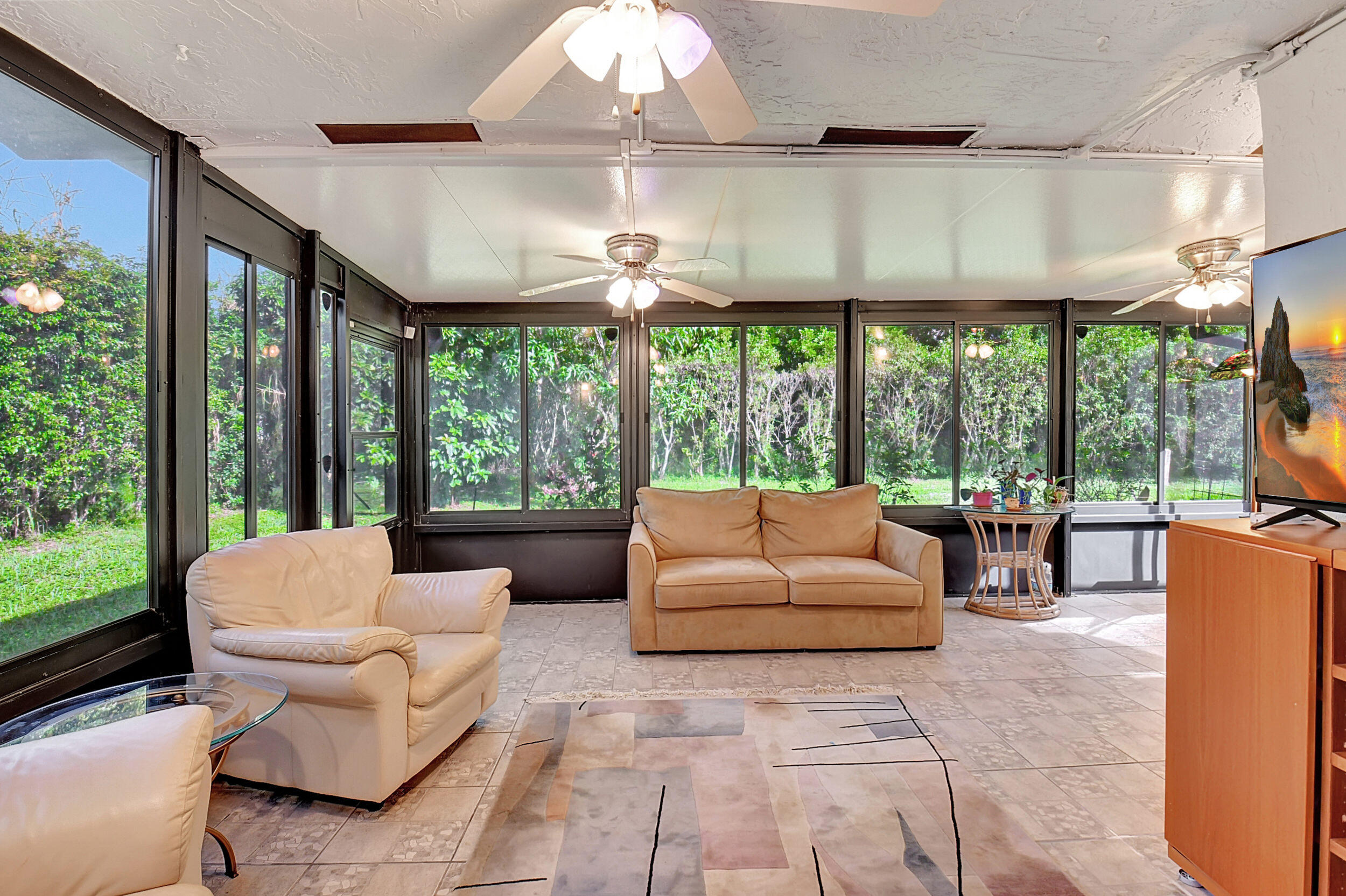 14520 Lucy Drive Delray Beach, FL 33484 - Photo 2 of 63 a living room with furniture and a large window