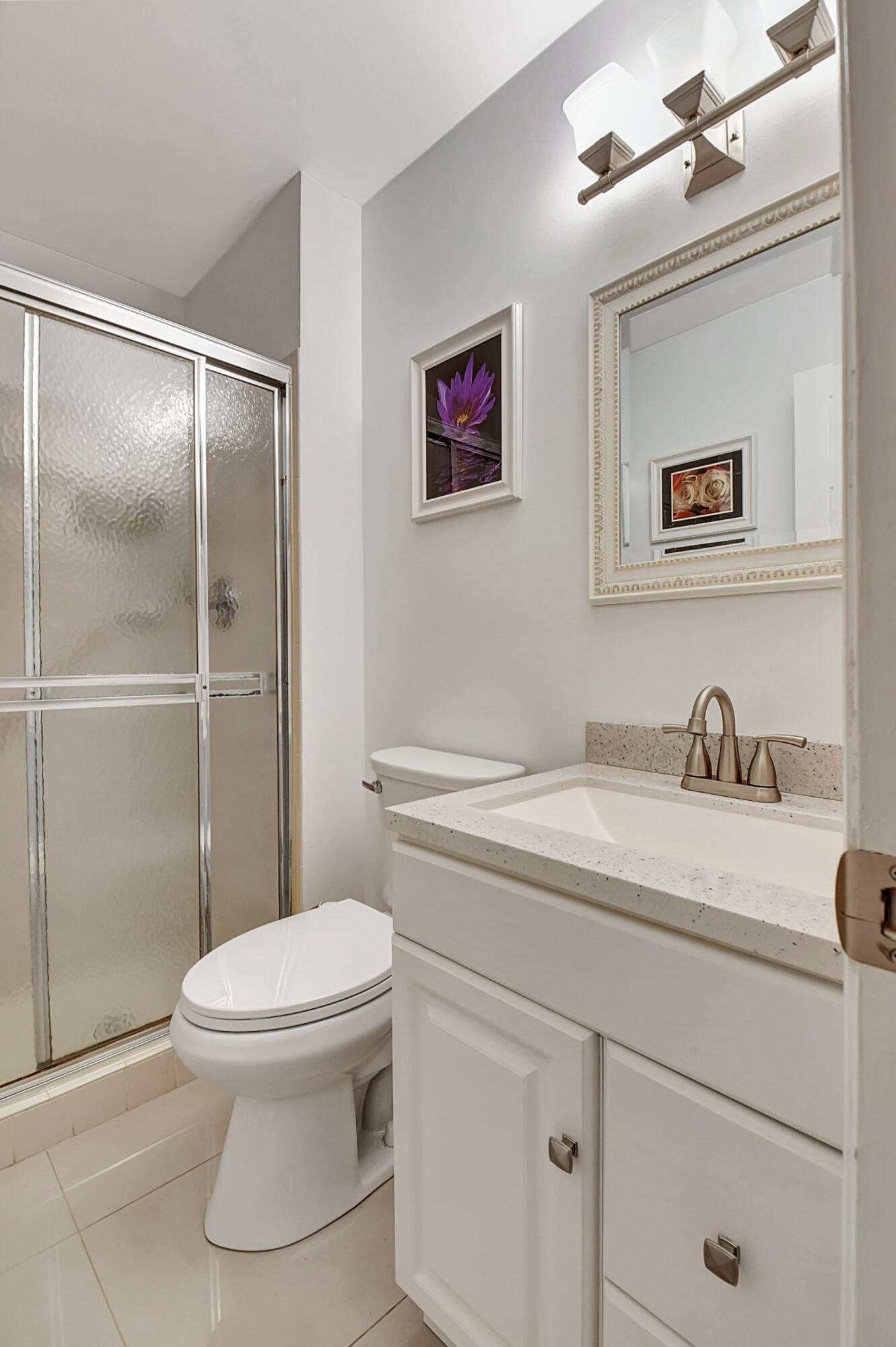 14520 Lucy Drive Delray Beach, FL 33484 - Photo 23 of 63 a bathroom with a granite countertop sink mirror vanity and toilet