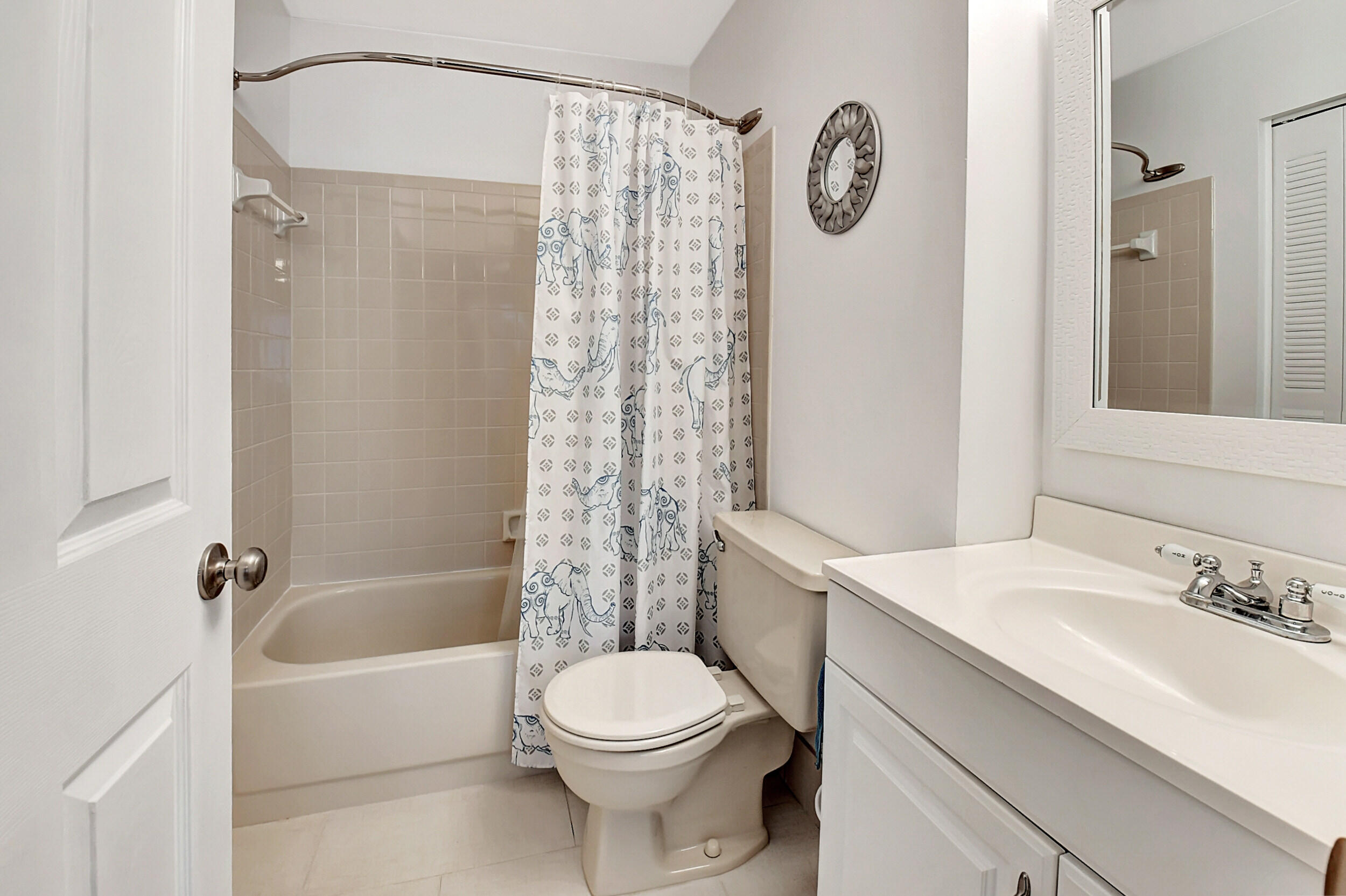 14520 Lucy Drive Delray Beach, FL 33484 - Photo 27 of 63 a bathroom with a sink a toilet and a bathtub