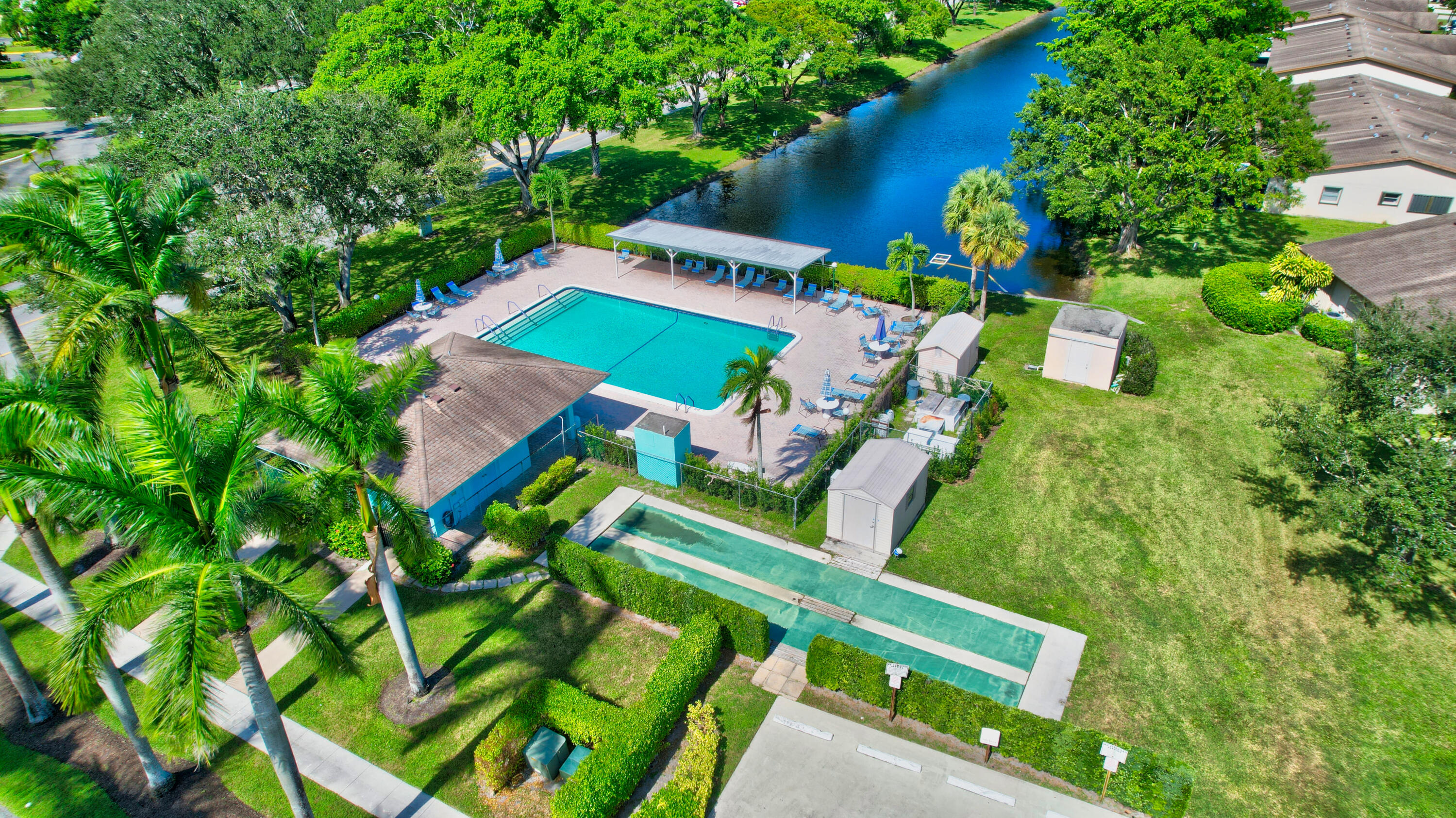 14520 Lucy Drive Delray Beach, FL 33484 - Photo 40 of 63 an aerial view of a house with a yard and lake view