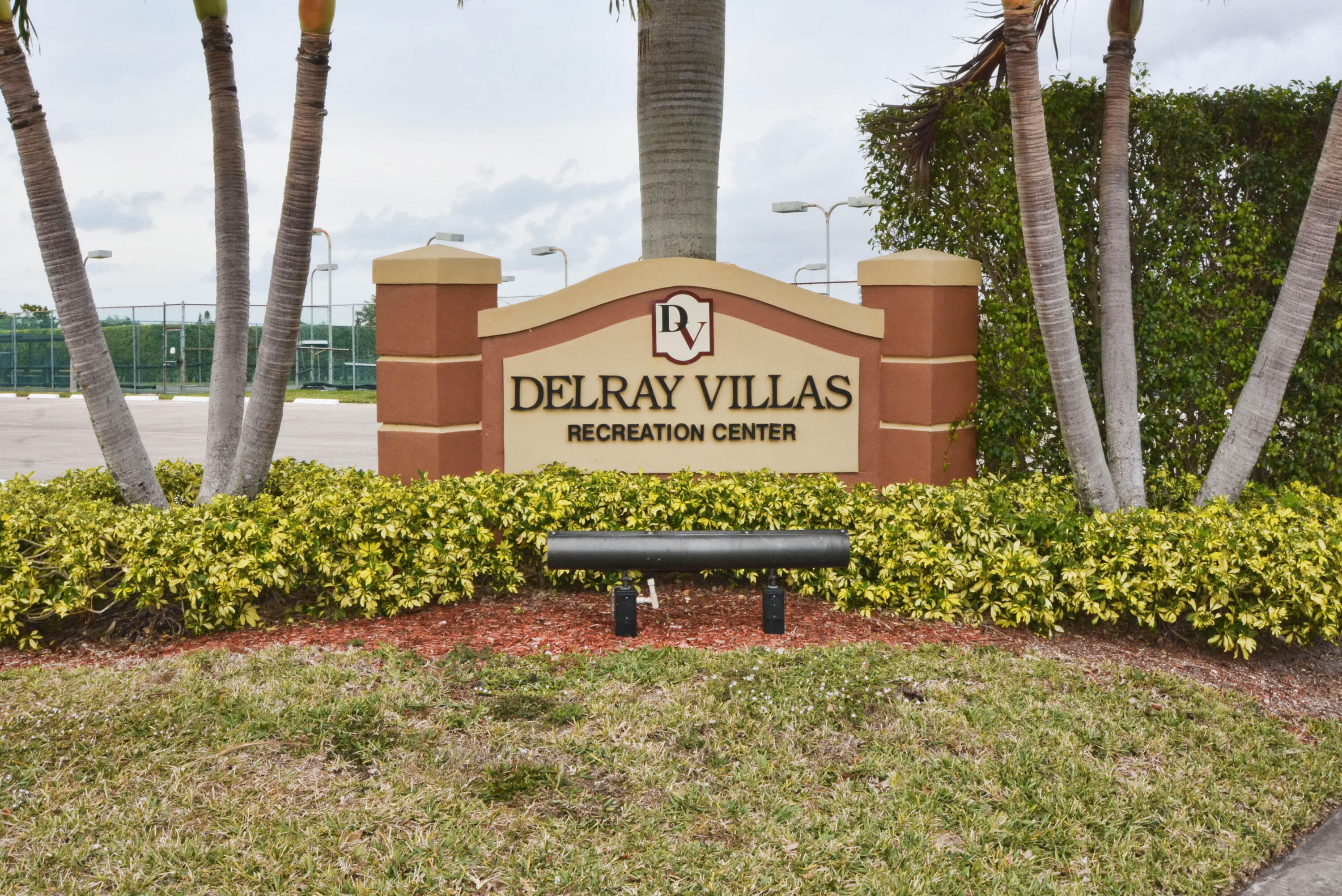 14520 Lucy Drive Delray Beach, FL 33484 - Photo 41 of 63 a sign on the side of a building